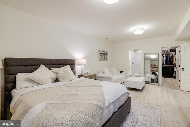 1544 Forest Villa Ln, Mclean, VA 22101 - bedroom featuring light wood-type flooring, a spacious closet, a closet, and ensuite bath
