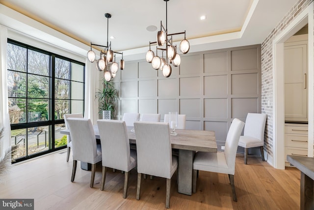 1544 Forest Villa Ln, Mclean, VA 22101 - dining area featuring a decorative wall, a chandelier, and light wood finished floors