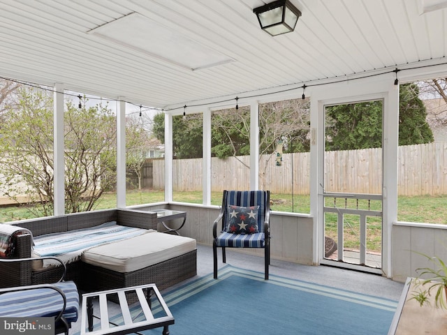 sunroom / solarium with outdoor lounge area and a healthy amount of sunlight