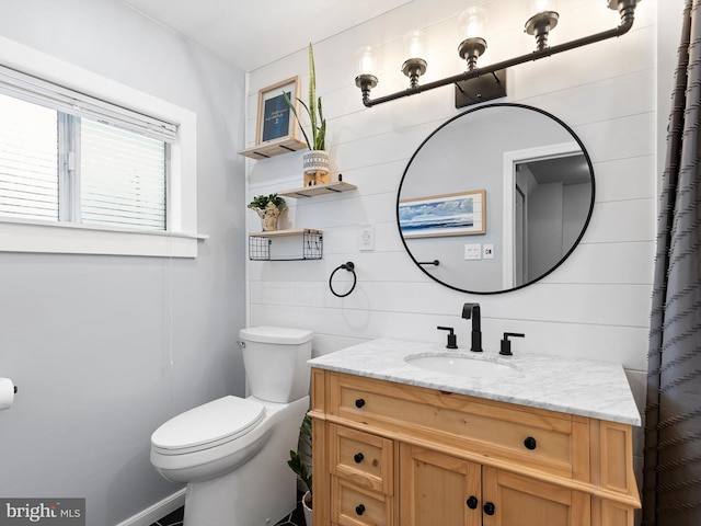 bathroom featuring toilet and vanity