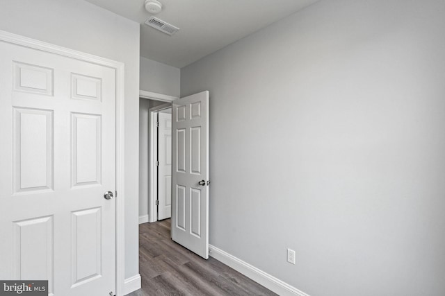 1404 S Patton St, Philadelphia, PA 19146 - unfurnished bedroom featuring dark wood finished floors, baseboards, and visible vents