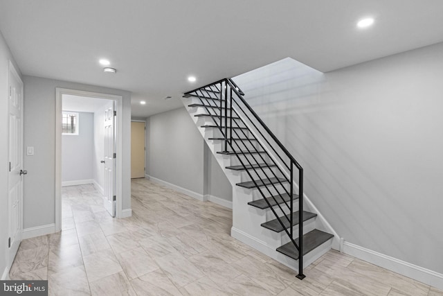 1404 S Patton St, Philadelphia, PA 19146 - stairway with marble finish floor, baseboards, and recessed lighting