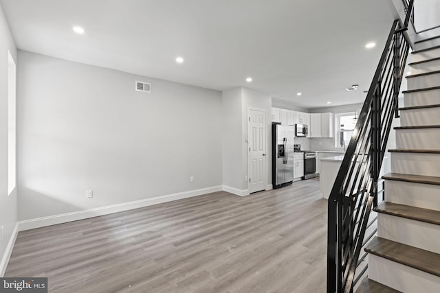 1404 S Patton St, Philadelphia, PA 19146 - stairway featuring baseboards, visible vents, wood finished floors, and recessed lighting