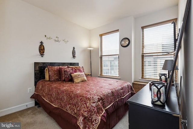 bedroom with baseboards and carpet floors