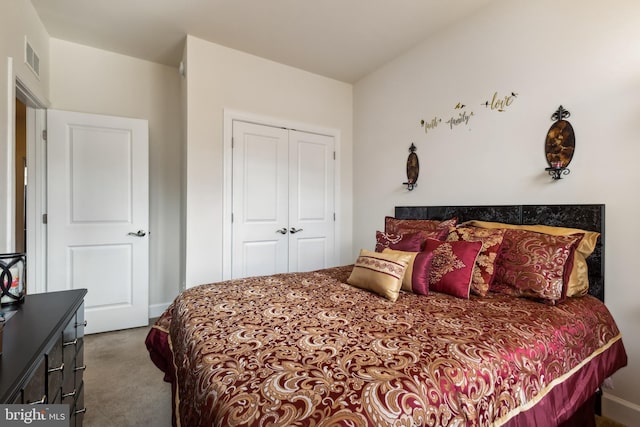 carpeted bedroom with a closet and visible vents