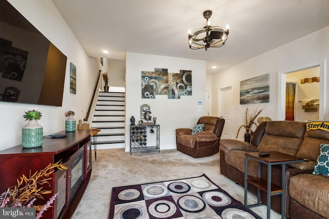 living area featuring a chandelier, recessed lighting, stairway, and light colored carpet