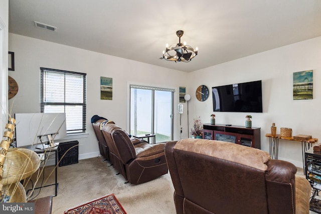 living room with light colored carpet, an inviting chandelier, baseboards, and visible vents