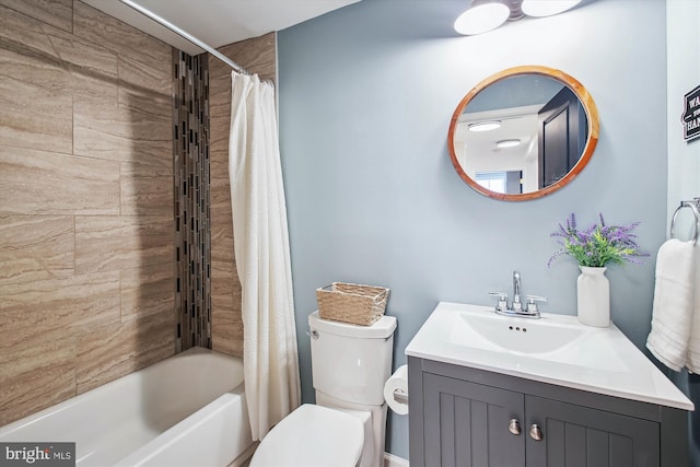 bathroom featuring toilet, vanity, and shower / bath combination with curtain