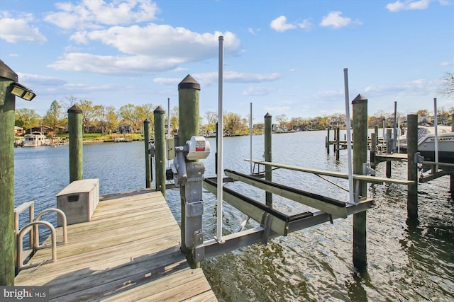 view of dock with a water view and boat lift