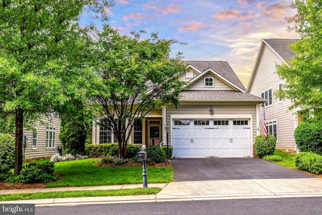 20559 Crescent Pointe Pl, Ashburn, VA 20147 - view of front facade with driveway, a shingled roof, an attached garage, and a front lawn