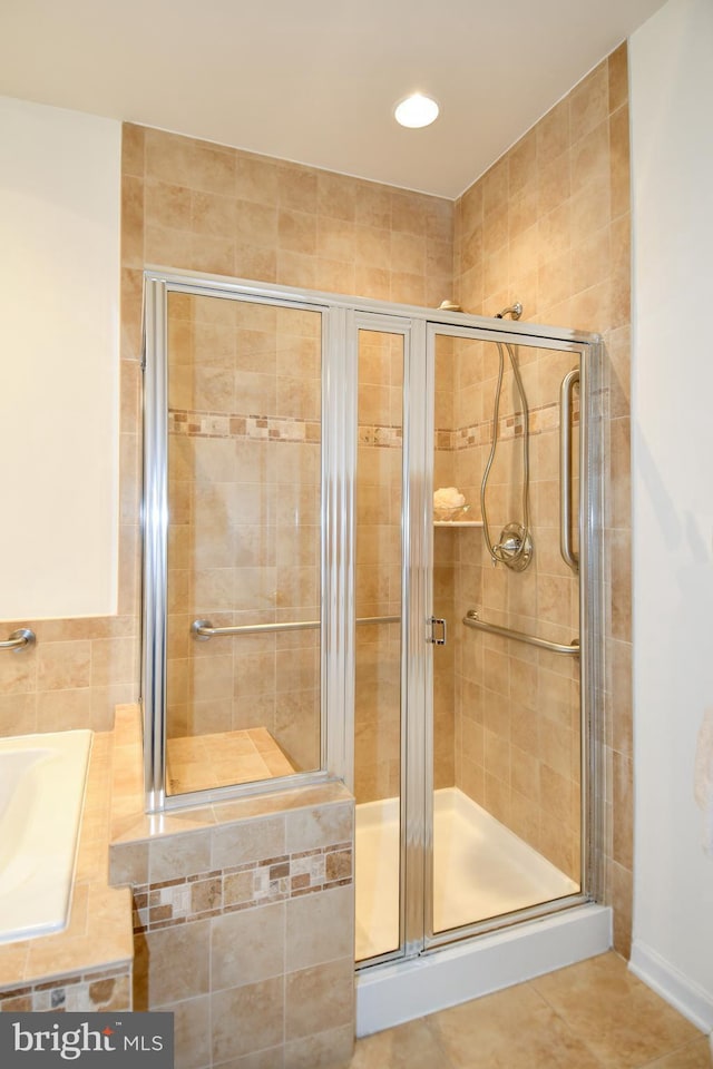20559 Crescent Pointe Pl, Ashburn, VA 20147 - bathroom featuring a shower stall, tile patterned flooring, and a bathtub