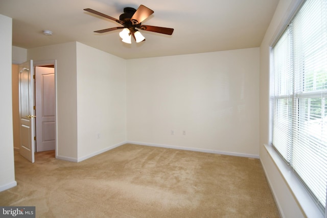 20559 Crescent Pointe Pl, Ashburn, VA 20147 - spare room with light carpet, ceiling fan, baseboards, and a smoke detector