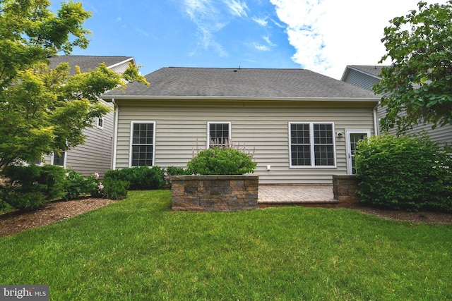 20559 Crescent Pointe Pl, Ashburn, VA 20147 - rear view of property with a yard and roof with shingles