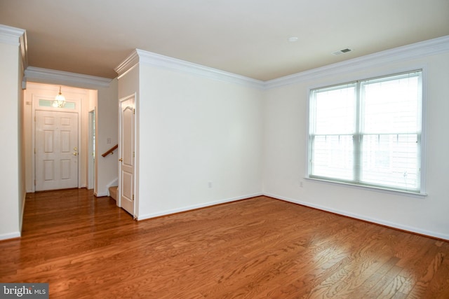 20559 Crescent Pointe Pl, Ashburn, VA 20147 - empty room with wood finished floors, ornamental molding, baseboards, and stairs