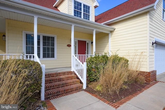 304 S Heron Gull Ct, Ocean City, MD 21842 - doorway to property with covered porch and a garage