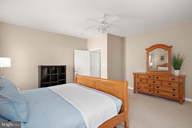 304 S Heron Gull Ct, Ocean City, MD 21842 - bedroom with baseboards, a ceiling fan, and light carpet