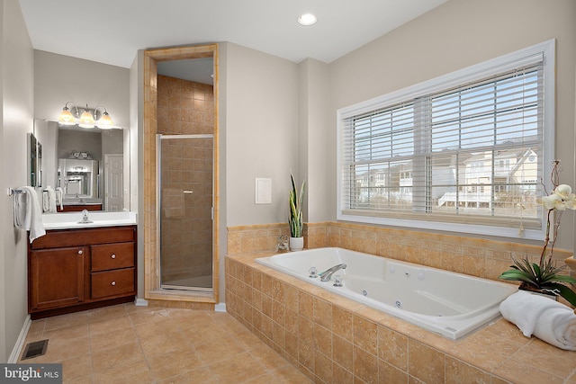 304 S Heron Gull Ct, Ocean City, MD 21842 - bathroom with a stall shower, a tub with jets, visible vents, and tile patterned flooring