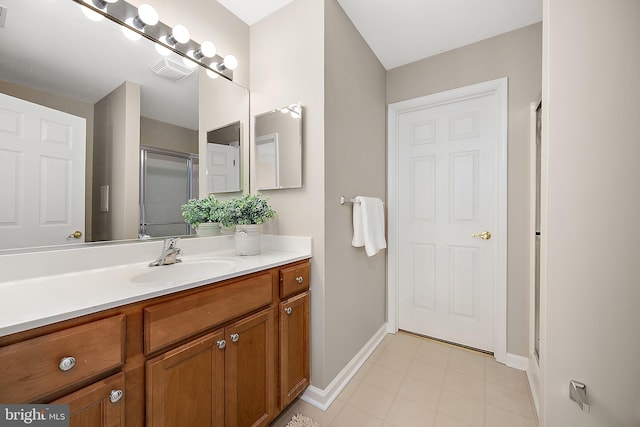 304 S Heron Gull Ct, Ocean City, MD 21842 - full bathroom with baseboards, visible vents, vanity, and a shower with shower door