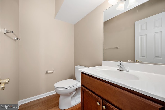 304 S Heron Gull Ct, Ocean City, MD 21842 - bathroom featuring toilet, vanity, baseboards, and wood finished floors