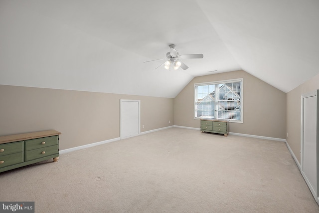 304 S Heron Gull Ct, Ocean City, MD 21842 - bonus room featuring baseboards, lofted ceiling, ceiling fan, and light colored carpet