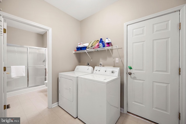 304 S Heron Gull Ct, Ocean City, MD 21842 - laundry room with washing machine and dryer, baseboards, laundry area, and light floors
