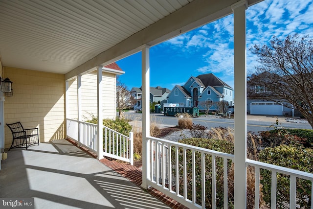 304 S Heron Gull Ct, Ocean City, MD 21842 - view of patio / terrace with a porch and a residential view