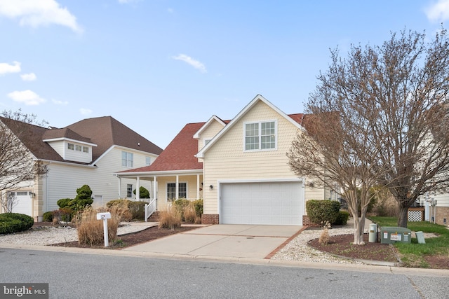 304 S Heron Gull Ct, Ocean City, MD 21842 - traditional home with a porch, driveway, and an attached garage