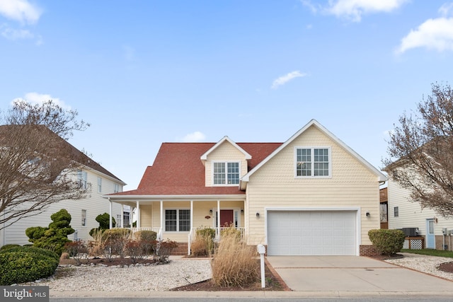 304 S Heron Gull Ct, Ocean City, MD 21842 - traditional-style house featuring a porch, driveway, and a garage