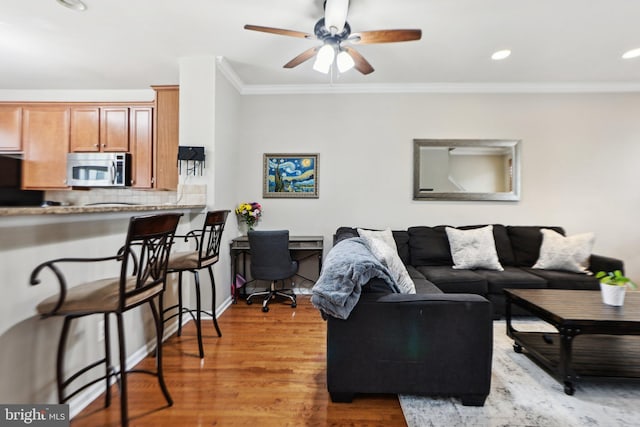 25149 Shultz Ter, Chantilly, VA 20152 - living room with ornamental molding, ceiling fan, wood finished floors, recessed lighting, and an office area