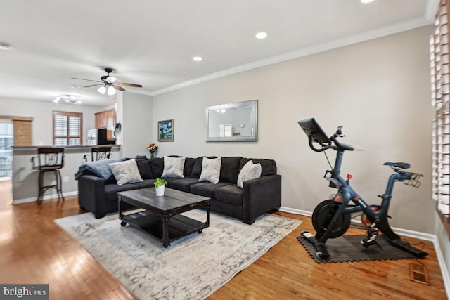 25149 Shultz Ter, Chantilly, VA 20152 - living area featuring ceiling fan, light wood finished floors, baseboards, recessed lighting, and ornamental molding