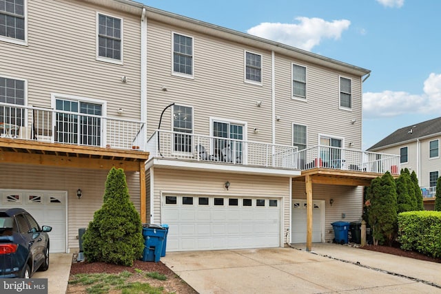 25149 Shultz Ter, Chantilly, VA 20152 - back of property featuring an attached garage and driveway