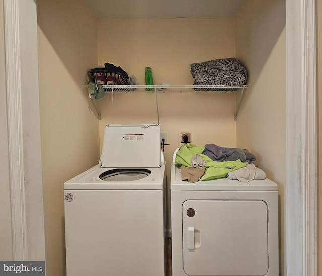 laundry room featuring washer and dryer and laundry area