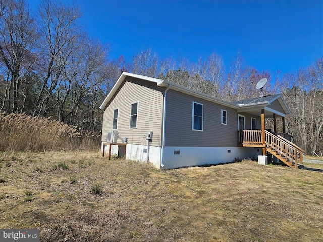 exterior space with crawl space and stairs