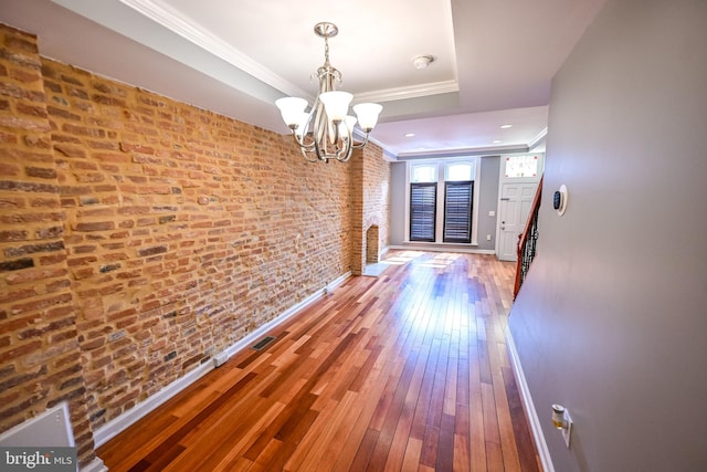 6 N Luzerne Ave, Baltimore, MD 21224 - hallway featuring a chandelier, crown molding, a tray ceiling, hardwood / wood-style floors, and baseboards