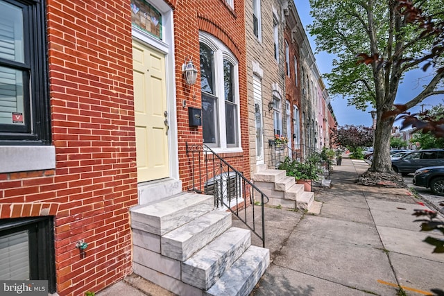 6 N Luzerne Ave, Baltimore, MD 21224 - property entrance with brick siding