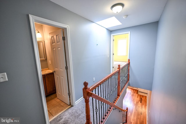 6 N Luzerne Ave, Baltimore, MD 21224 - hall featuring an upstairs landing and a skylight