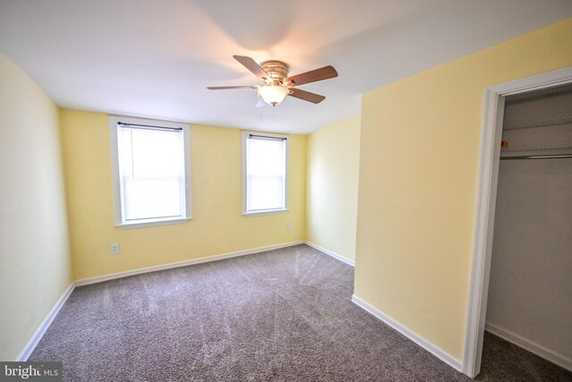 6 N Luzerne Ave, Baltimore, MD 21224 - unfurnished bedroom with carpet, baseboards, a ceiling fan, and a closet