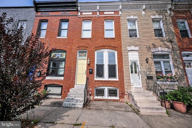 6 N Luzerne Ave, Baltimore, MD 21224 - townhome / multi-family property featuring entry steps and brick siding