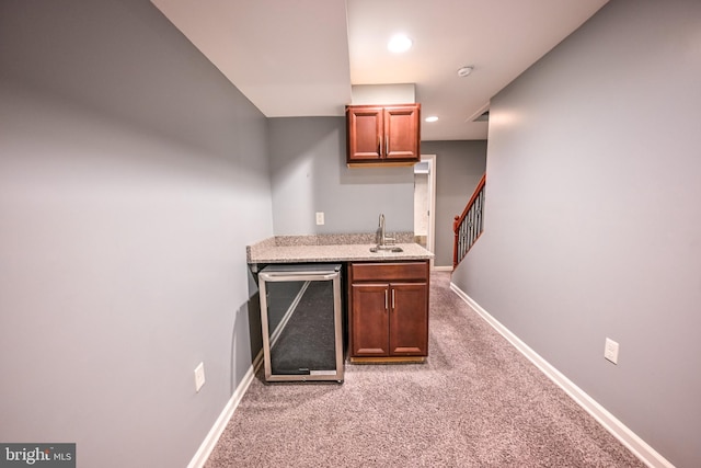 6 N Luzerne Ave, Baltimore, MD 21224 - indoor wet bar with light colored carpet, wine cooler, baseboards, and recessed lighting
