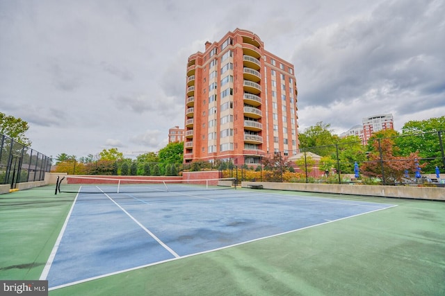 view of tennis court with fence