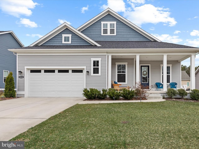 view of front of property with covered porch, roof with shingles, concrete driveway, an attached garage, and a front lawn