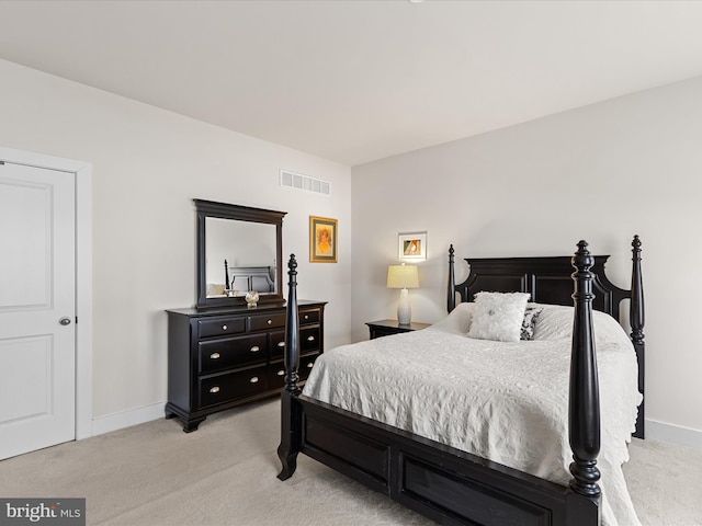 bedroom with light colored carpet, visible vents, and baseboards