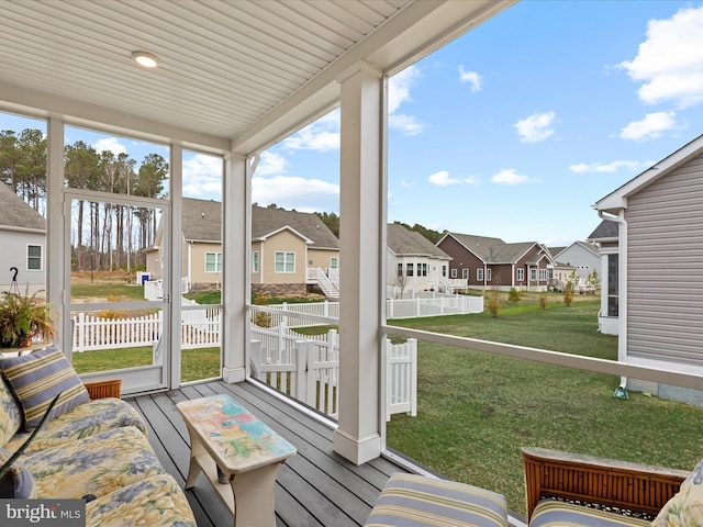 sunroom / solarium with a residential view