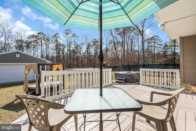 wooden deck with outdoor dining space and an outdoor structure