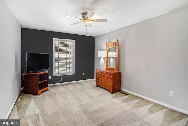 bedroom with visible vents, baseboards, ceiling fan, and carpet