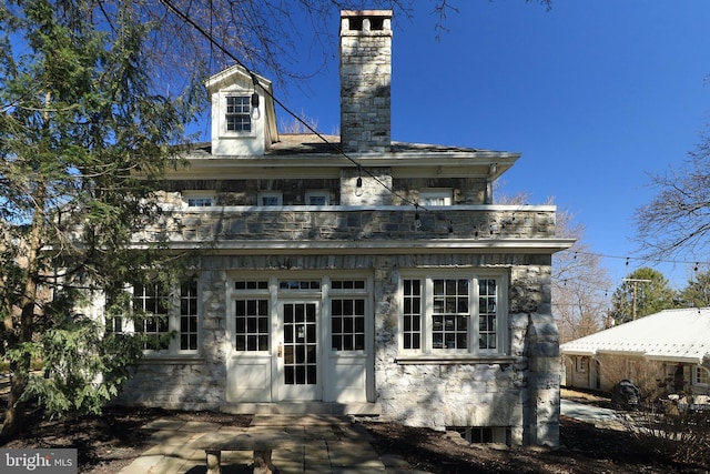 234 W Fairmount Ave, State College, PA 16801 - view of front of house with a chimney, stone siding, and a balcony