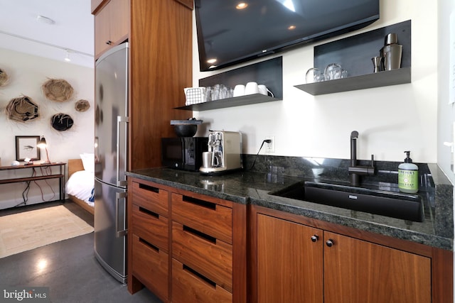 234 W Fairmount Ave, State College, PA 16801 - kitchen with stainless steel fridge, a sink, open shelves, brown cabinets, and rail lighting
