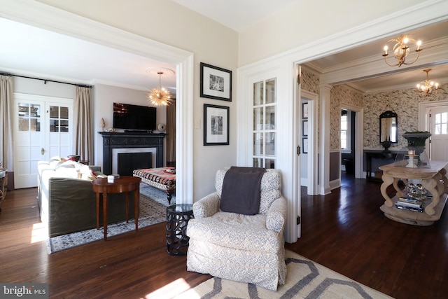 234 W Fairmount Ave, State College, PA 16801 - sitting room featuring crown molding, wood finished floors, a chandelier, a fireplace, and wallpapered walls