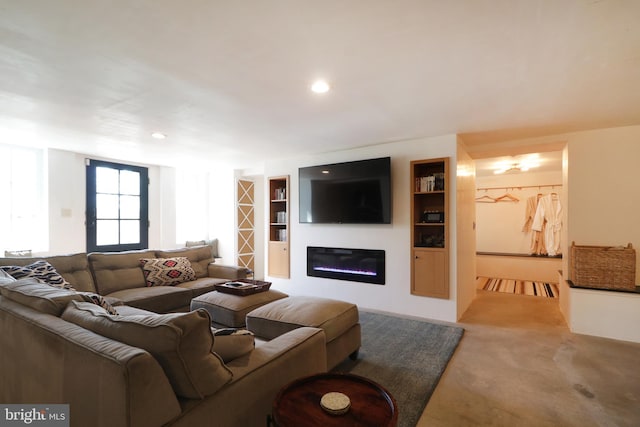 234 W Fairmount Ave, State College, PA 16801 - carpeted living room featuring a glass covered fireplace, built in shelves, and recessed lighting