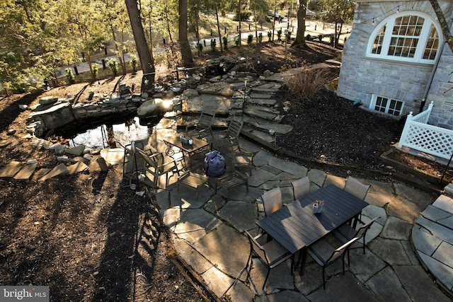 234 W Fairmount Ave, State College, PA 16801 - exterior view of stone siding and a garden pond